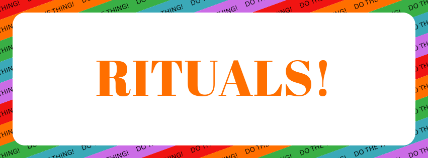 Image Description: A white rounded rectangle on a background of red, orange, green, blue, and purple repeating diagonal stripes with text reading "DO THE THING!" repeating along each stripe. Inside the white rounded rectangle is orange text that reads "RITUALS!"